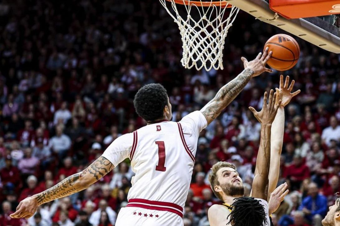 Image of a skilled basketball player in action, illustrating the competitiveness in Iowa Men